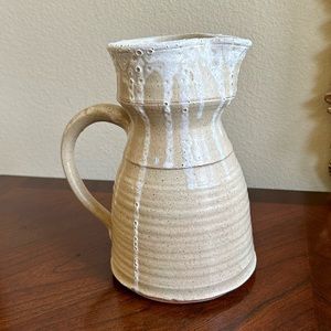 Hand thrown signed vanilla and white color rustic pottery pitcher